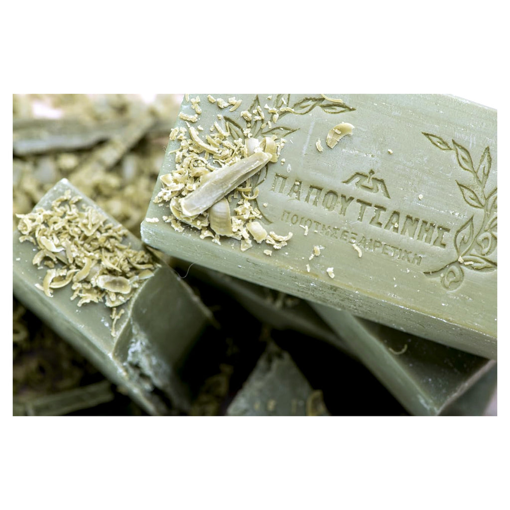 Green soap bars with decorative elements on a white background